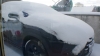 Car in snow blanket